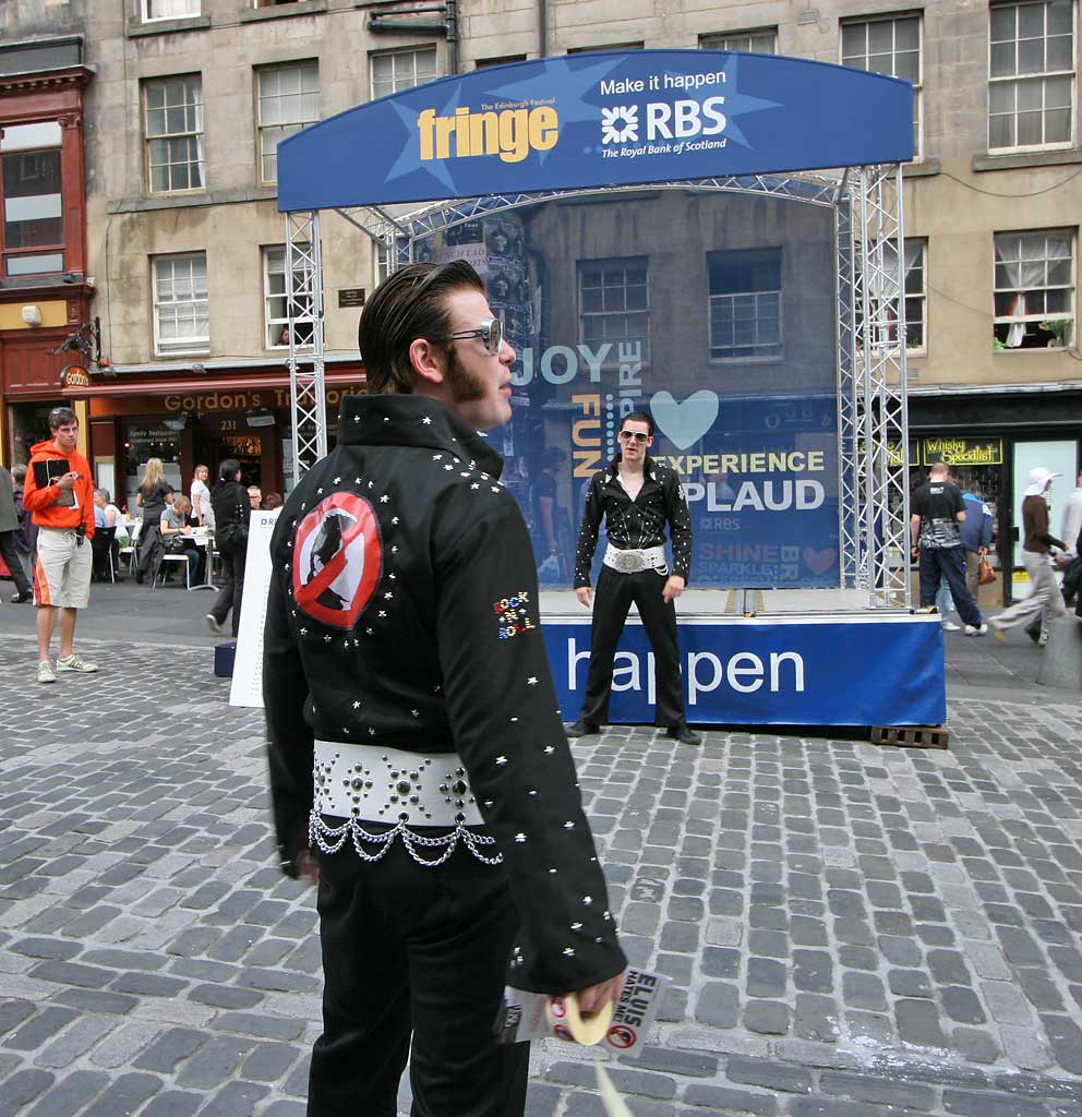 Two 'Elvis's about to confront each other in their street theatre in the High Street - August 2008