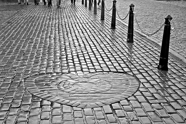 The Heart of Midlothian , set in the cobbles near the NW corner of St Giles Church in High Street, Edinburgh