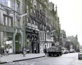 High Street  -  looking to the east from the junction with South Bridge.  Street lights are mounted on the wall