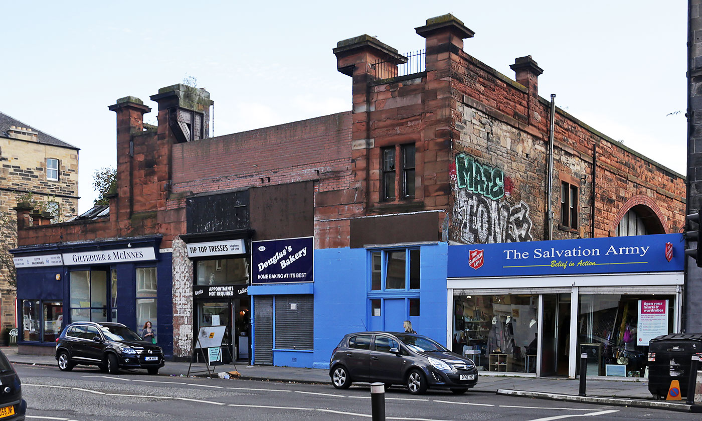 Shops at No.99 to No. 109, Leith Walk, photographed in August 2014.  No.109 Leithj Walk was the address of Giibson's Aeroplane Works in 1910