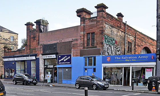 Shops at 99-109 Leith Walk, including the site where Gibson's Aeroplane Factory stood in 1910.  Photo taken 2014