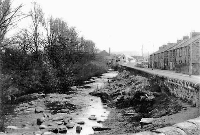 Looking to the east along the Water of Lieth and Longstone Road from the Longstone Inn  -  photographed around 1960