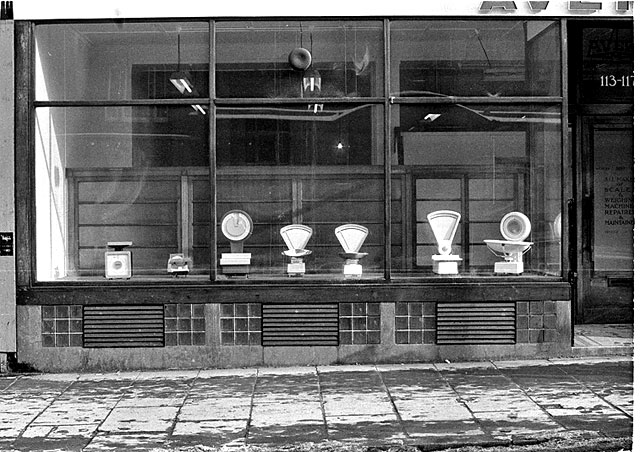 Scales in the window of W&T Avery Ltd premises, 113-117 Lothian Road - late-1970s