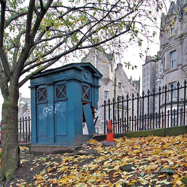 Police Box (now damaged) at the foot of Market Street, at the SE corner of East Princes Street Gardens
