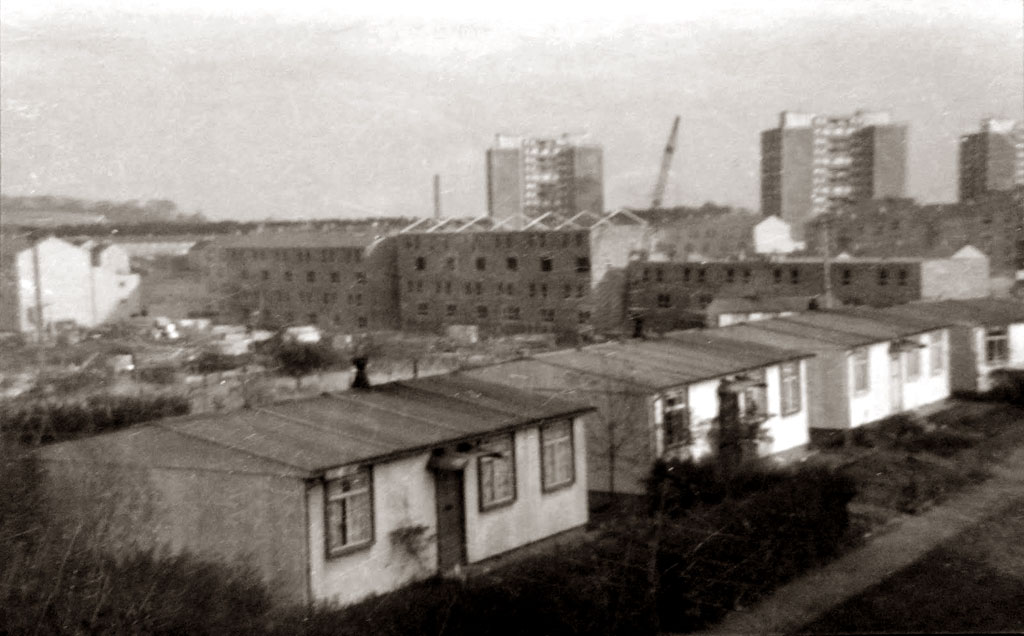 Oxgangs Avenue  -  Prefabs in the foreground and high-rise flats in the background.