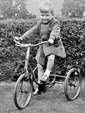 Douglas Roberts on his Tricycle in his Garden at Pilton Avenue  -  Around 1956