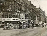 Photograph by Norward Inglis  -  A procession along Princes Street approaches the salute at Hanover Street  -  early-1950s