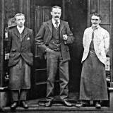 Otto Goll and 2 other men outside his Hairdressing Saloon, Raeburn Place, Stockbridge, Edinburgh