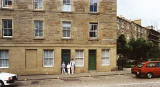 Joseph Watt's family outside his old tenement home at 77 St Leonard Street.  Photo taken on a return visit to Edinburgh, around 990. 