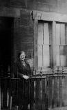 Christina Stewart (Nairn) outside 12 Springfield Place, around 1930