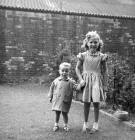 Forbes Wilson and his Cousin, Lorraine,  in a back garden at 28 Thorntree Street, Leith  -  1960