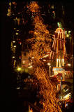 The torchlight processsion passes along Waterloo Place on its way to Calton Hill.  This photo looks down from Calton Hill on the precession and the helter skelter inWaterloo Place.