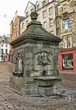 West Bow Well at the foot of West Bow  -  with West Bow, leading into Victoria Street in the background