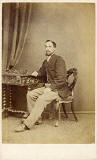 A carte de visite by the Edinburgh professional photographer John Ross   -  from his studio at 5 Lothian Road  -  man on a chair