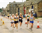 Edinburgh Waterfront  -  Marathon Runners pass P & J Tyres  -  15 June 2003