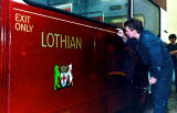 Gold Line being applied to one of the Lothian Buses at the Paintshop at Seafield.