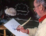 Saxe Shaw, using a quill to draw a cat