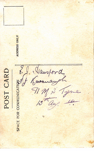 The back of postcard by an uniderntified photographer, of two postmen and a dog, with a backdrop of the Forth Bridge