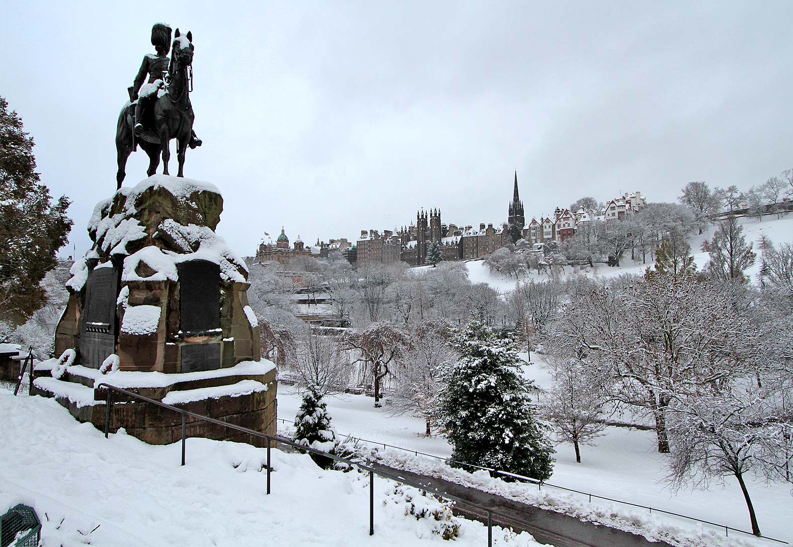 Royal Scots Greys Statue in West Princes Street Gardens  -  Edinburgh Old Town in the background
