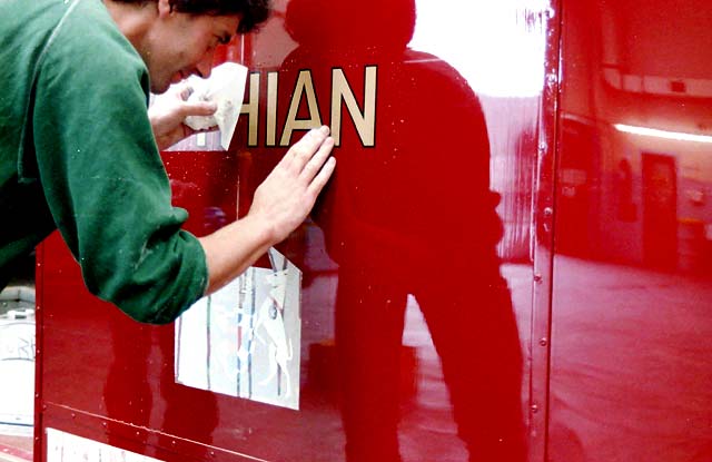 Gold Line being applied to one of the Lothian Buses at the Paintshop at Seafield.Two buses, one a Leyland Titan PD2 being painted at Seafield Paintshop