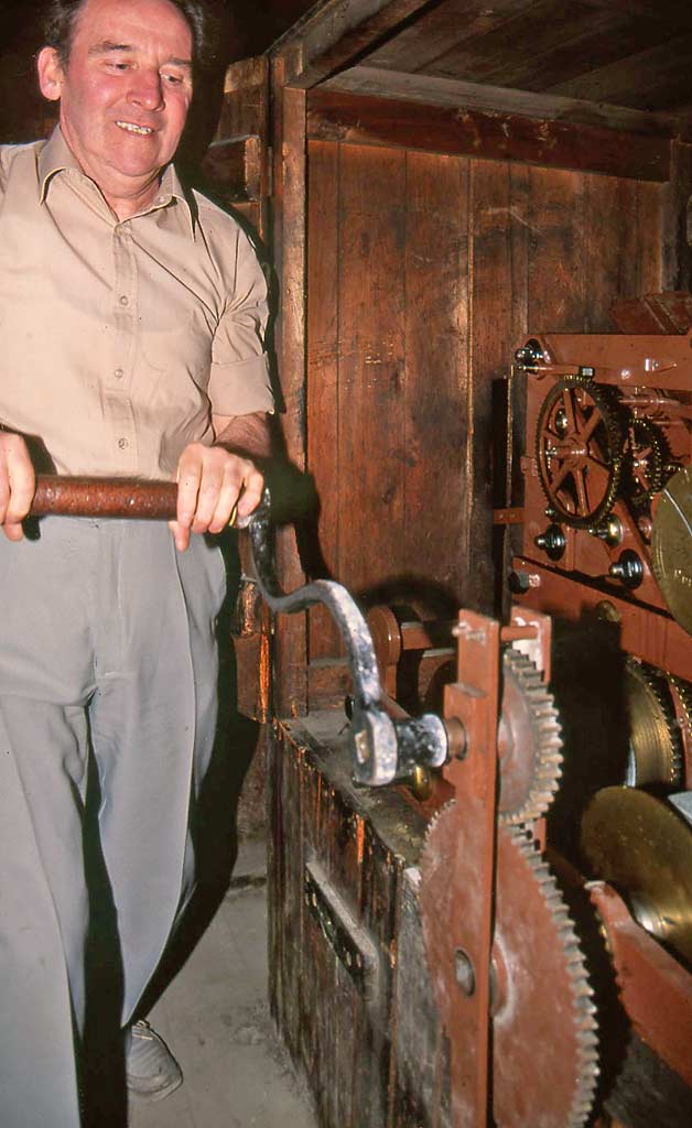 The clockwinder, winding the clock at St Andrew's & St George's Church